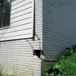A damaged foundation with wall cracking in Carlin